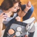 kaboompics.com_Closeup of a young woman applying perfume